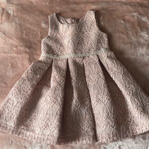 Beautiful blush dress with pearls in the middle of the waist. Wore once!